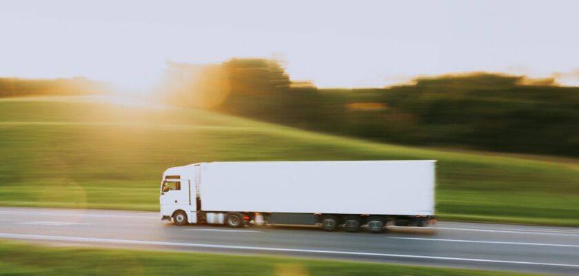 white-truck-in-motion-blur-at-sunset